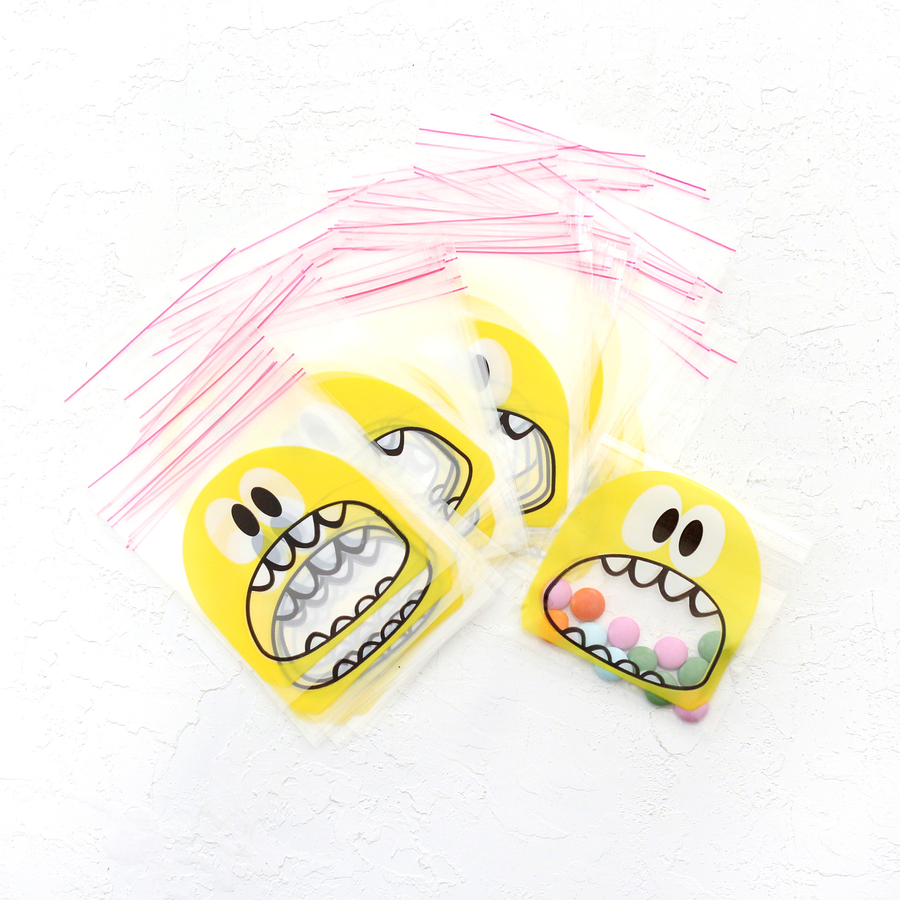 Transparent bag with yellow monster print tape, 10x15 cm / 1000 pcs - 1